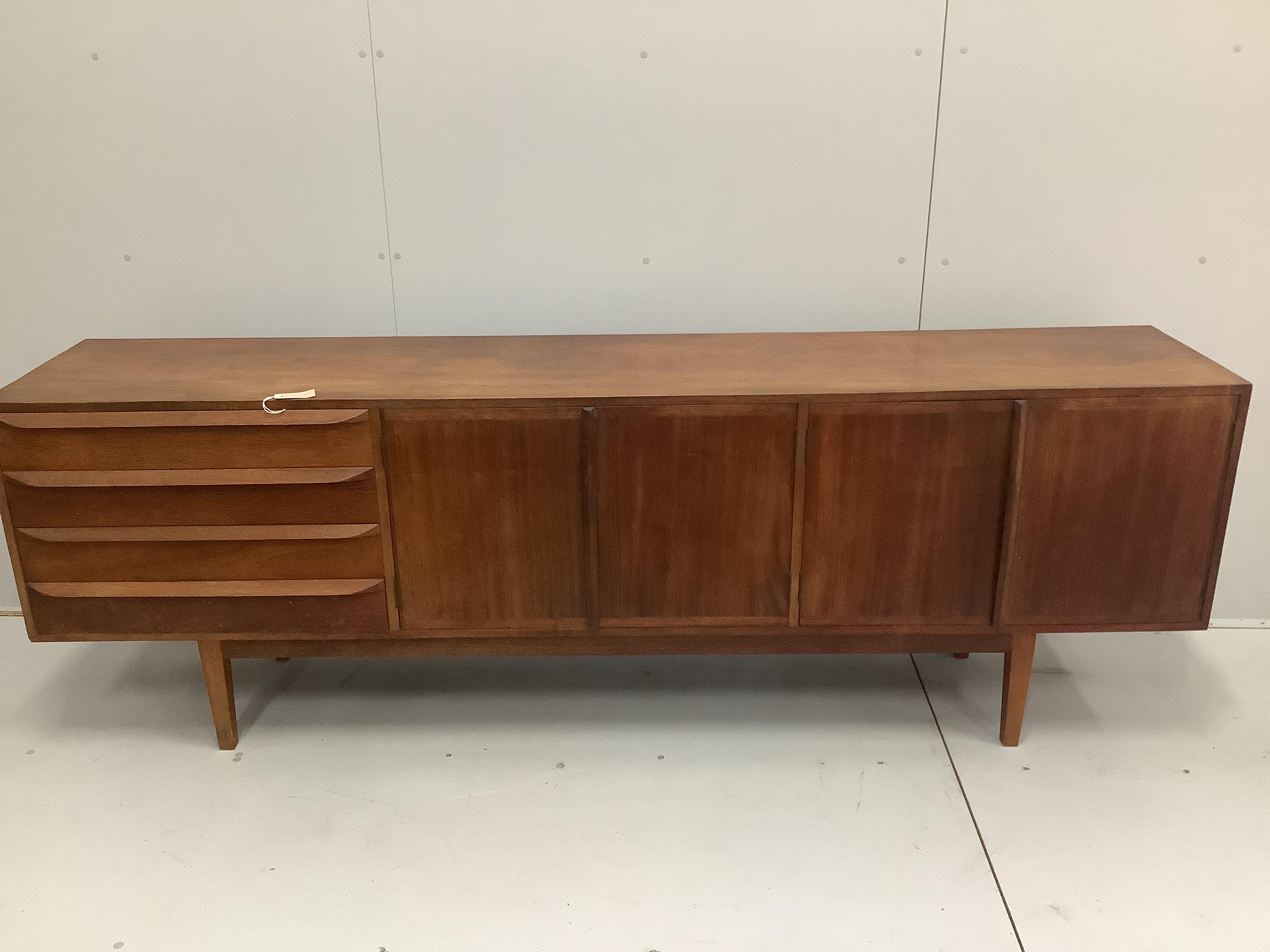 A mid century Danish teak sideboard by Erling Torvits, model 26, width 229cm, depth 44cm, height 76cm